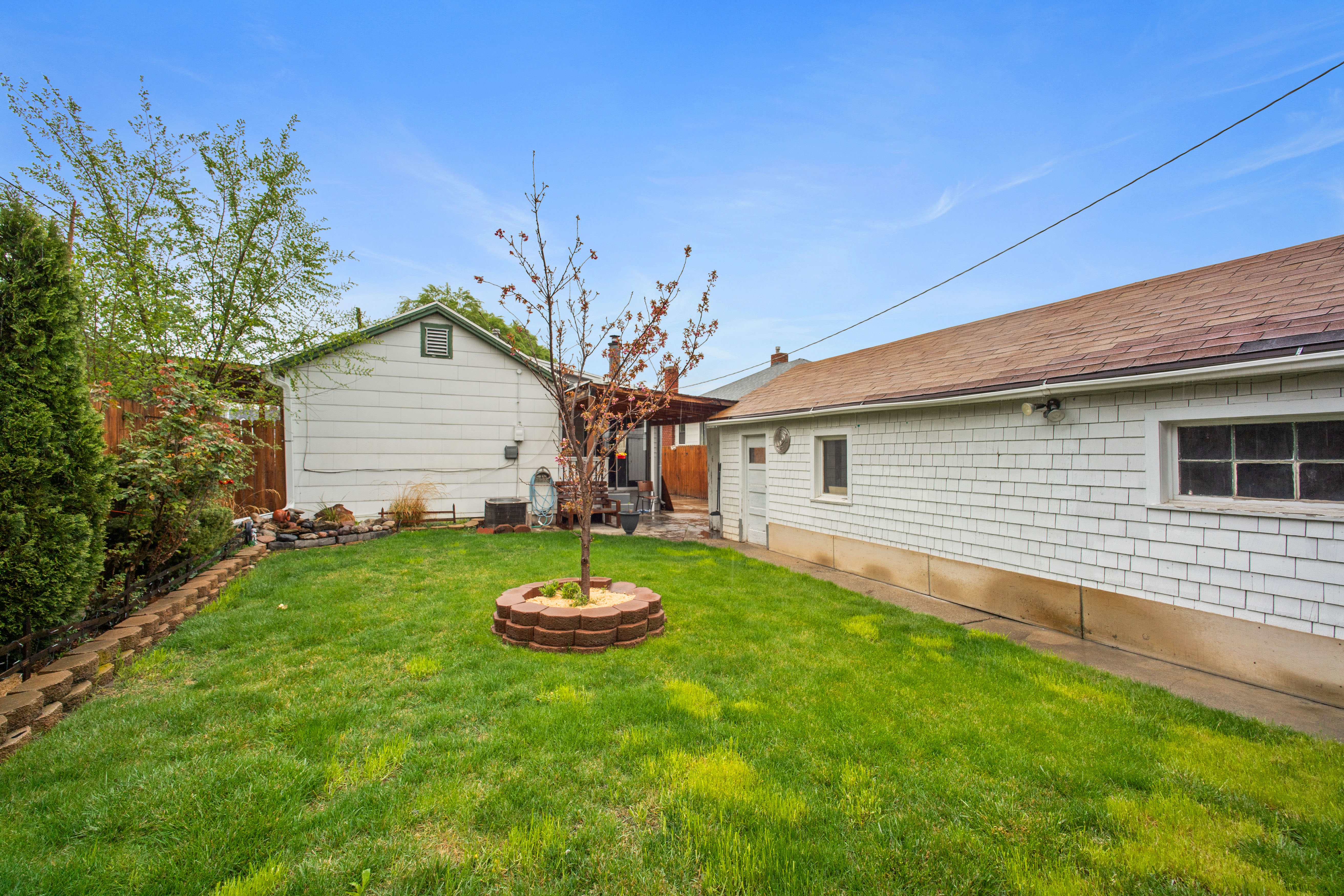 Back of property featuring a fenced backyard