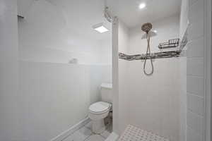 Bathroom with toilet and a shower stall