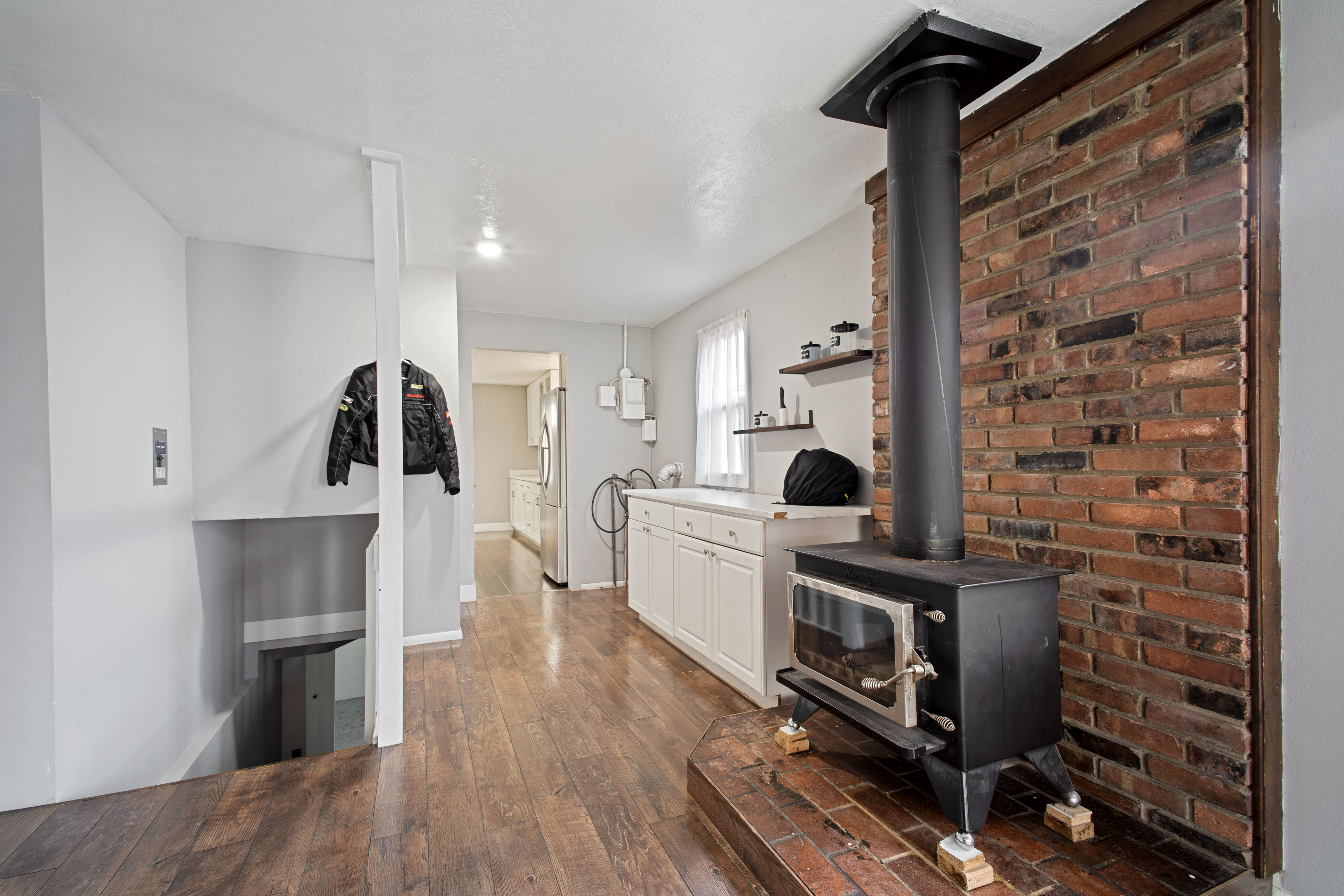 Laundry room featuring dark wood finished floors