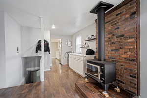 Laundry room featuring dark wood finished floors