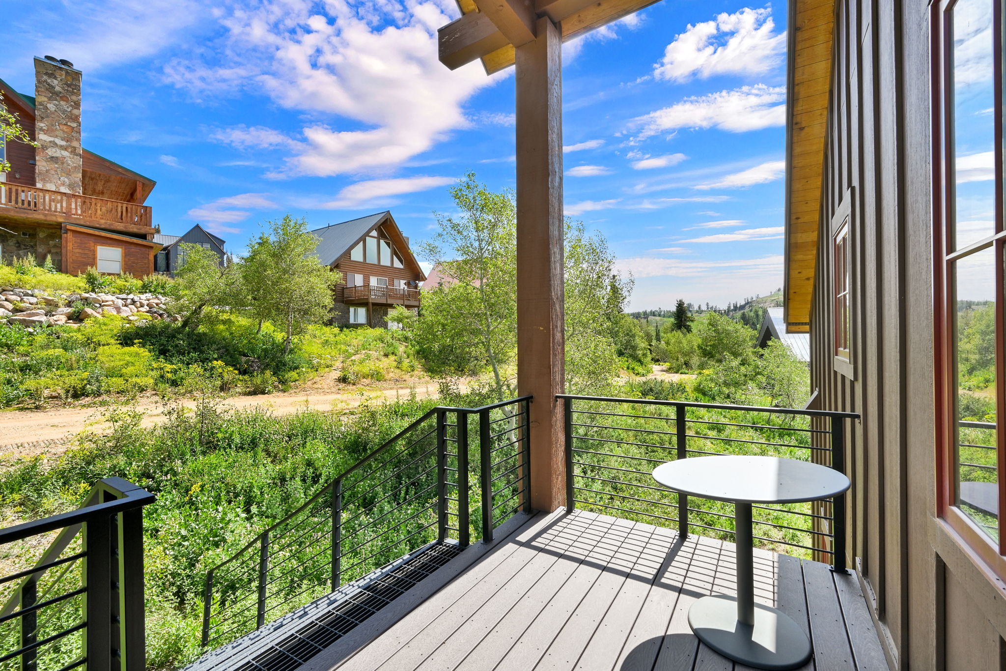 Outdoor Ski in ski out balcony featuring composite decking and cable railings