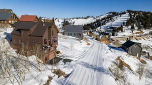 Snowy aerial view featuring a residential view