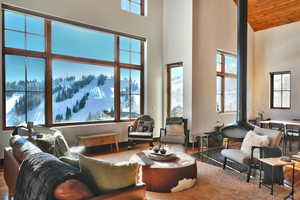 Living area with a high ceiling and wood finished floors