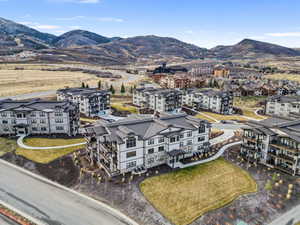 Aerial view of a mountainous background and apartment complex