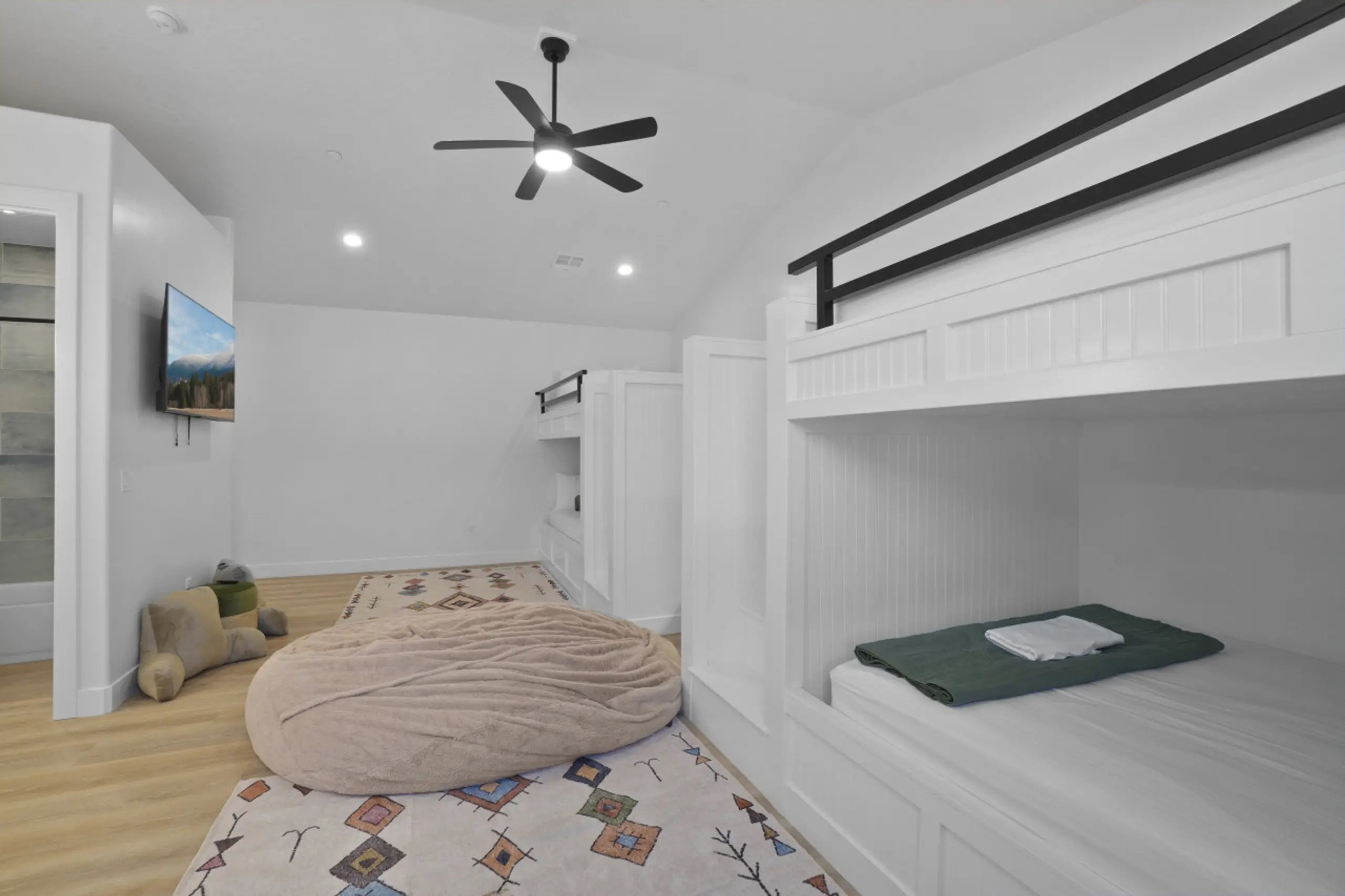 Bedroom with light wood-style floors, vaulted ceiling, ceiling fan, and recessed lighting