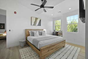 Bedroom featuring light wood finished floors, recessed lighting, and a ceiling fan