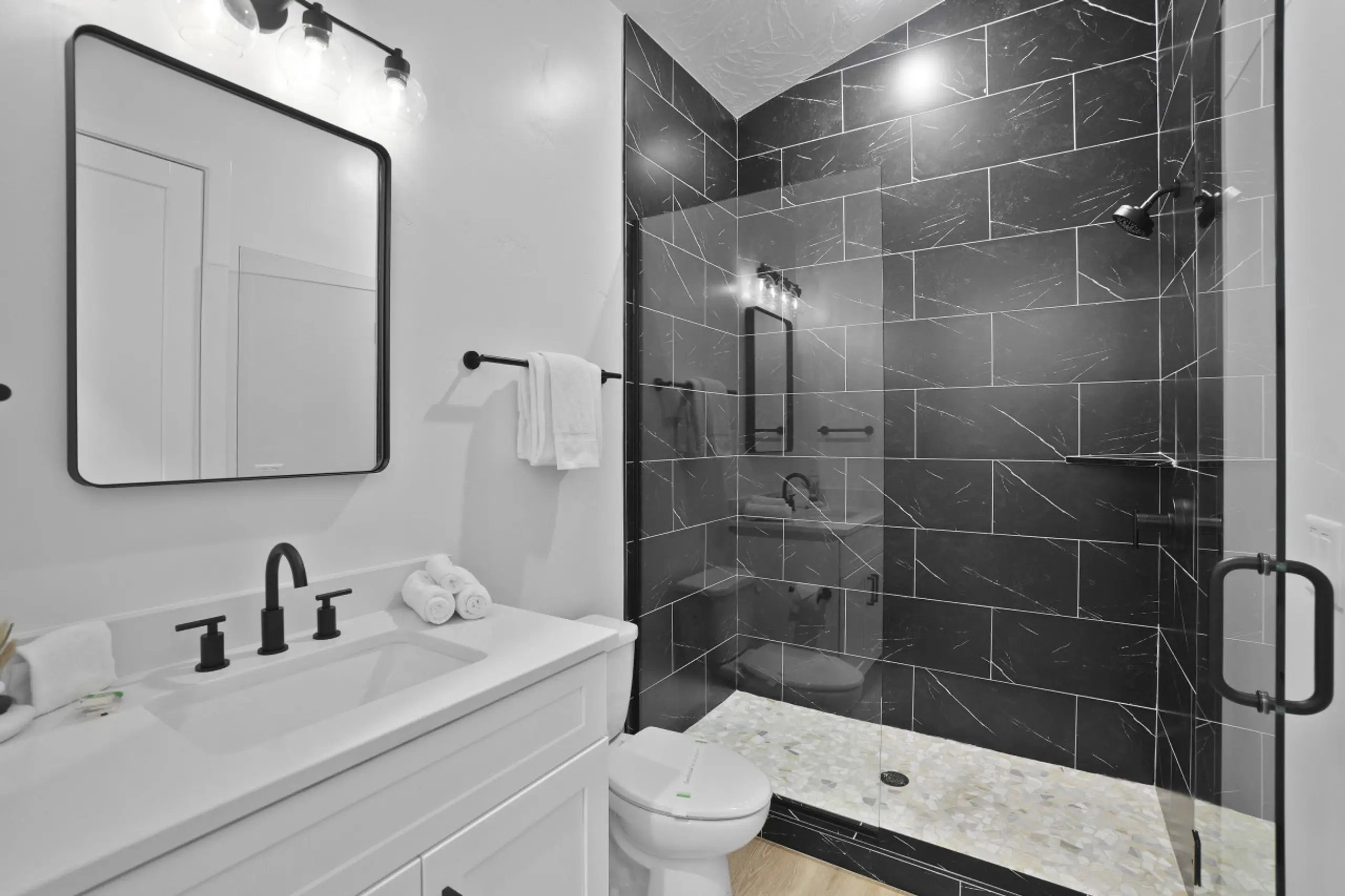 Full bath with a stall shower and vanity