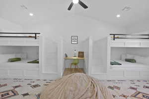 Bedroom featuring recessed lighting, lofted ceiling, ceiling fan, and wood finished floors