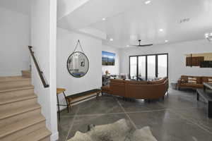 Living area featuring concrete floors, recessed lighting, and ceiling fan