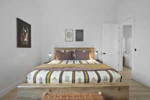 Bedroom with wood finished floors