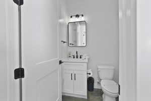 Bathroom with vanity and toilet