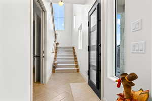 Entryway featuring plenty of natural light and parquet flooring