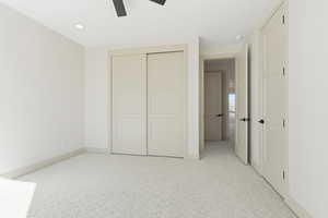 Unfurnished bedroom with light carpet, a closet, a ceiling fan, and recessed lighting