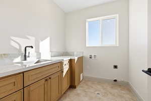 Laundry room featuring washer hookup, electric dryer hookup, and cabinet space