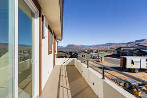 Balcony featuring a mountain view and a residential view