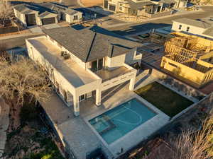 Aerial perspective of suburban area featuring a pool area