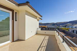 Balcony featuring a mountain view and a residential view