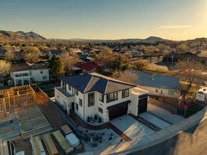 Aerial perspective of suburban area featuring a mountain backdrop