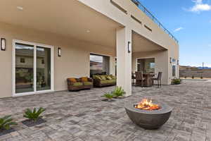 View of patio with a fire pit and an outdoor living / dining area