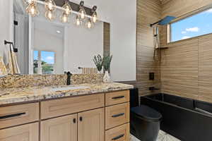 Full bath featuring vanity and tub / shower combination
