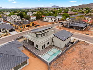 Aerial view of residential area featuring a mountainous background