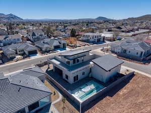 Aerial perspective of suburban area featuring a mountain backdrop