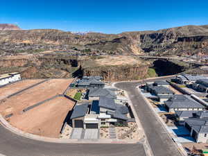 Aerial view of property's location featuring nearby suburban area and a mountain backdrop