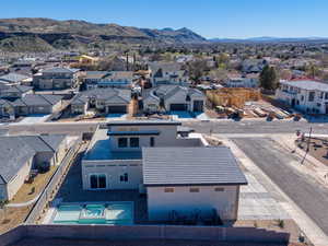 Aerial view of residential area featuring a mountainous background