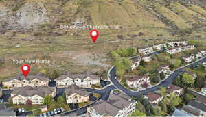 Aerial view of property's location featuring nearby suburban area