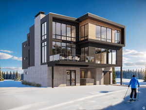 Snow covered building featuring an attached garage