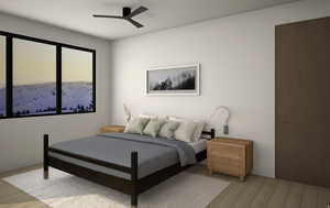 Bedroom featuring light wood finished floors and a ceiling fan