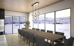 Dining space featuring wood ceiling, light wood-style flooring, and plenty of natural light