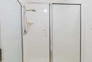 Full bath featuring a stall shower