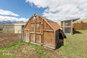 View of outbuilding featuring a mountain view