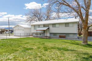 Split foyer home featuring a metal roof