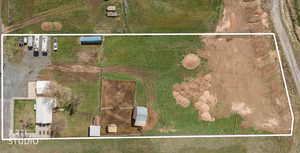 Aerial view of property and surrounding area featuring property boundaries highlighted