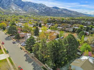 Aerial view of residential area featuring a mountain backdrop