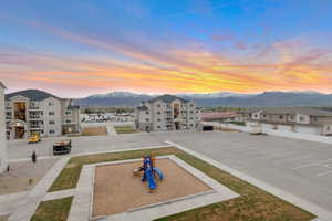 View of community featuring uncovered parking and a mountain view