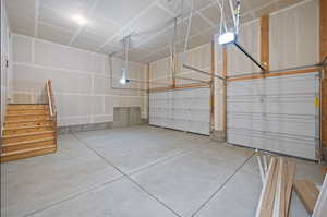 Garage featuring a garage door opener