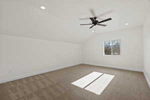 Additional living space with carpet, ceiling fan, vaulted ceiling, and recessed lighting