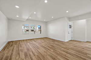 Spare room featuring light wood-style flooring and recessed lighting