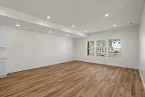 Unfurnished room with recessed lighting and light wood-type flooring