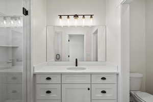 Bathroom with vanity and a stall shower