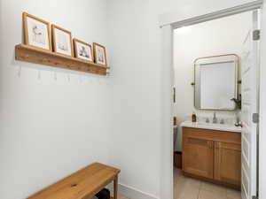 Bathroom featuring vanity and light tile patterned floors