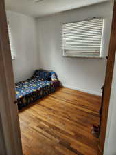 Bedroom featuring light wood-style flooring and baseboards