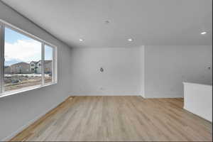 Unfurnished room featuring light wood-style floors and recessed lighting