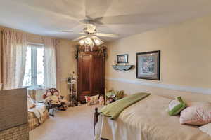 Bedroom featuring carpet and ceiling fan