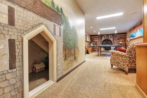 Hall with light carpet and built in features