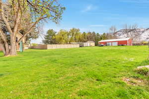 View of yard with a workshop and outbuildings, and a mountain view