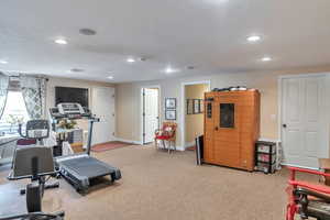 Workout area featuring recessed lighting and a sauna